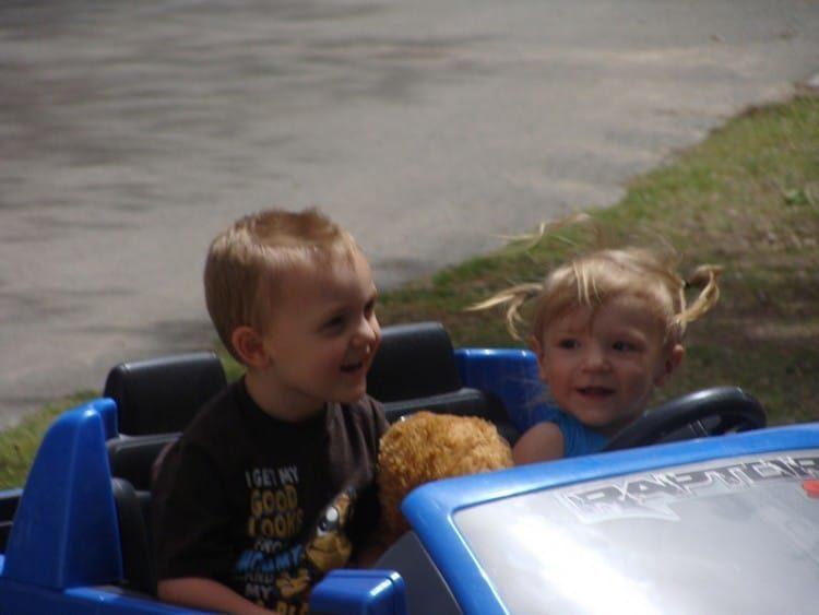 Corbin & Mattie driving blue ford truck