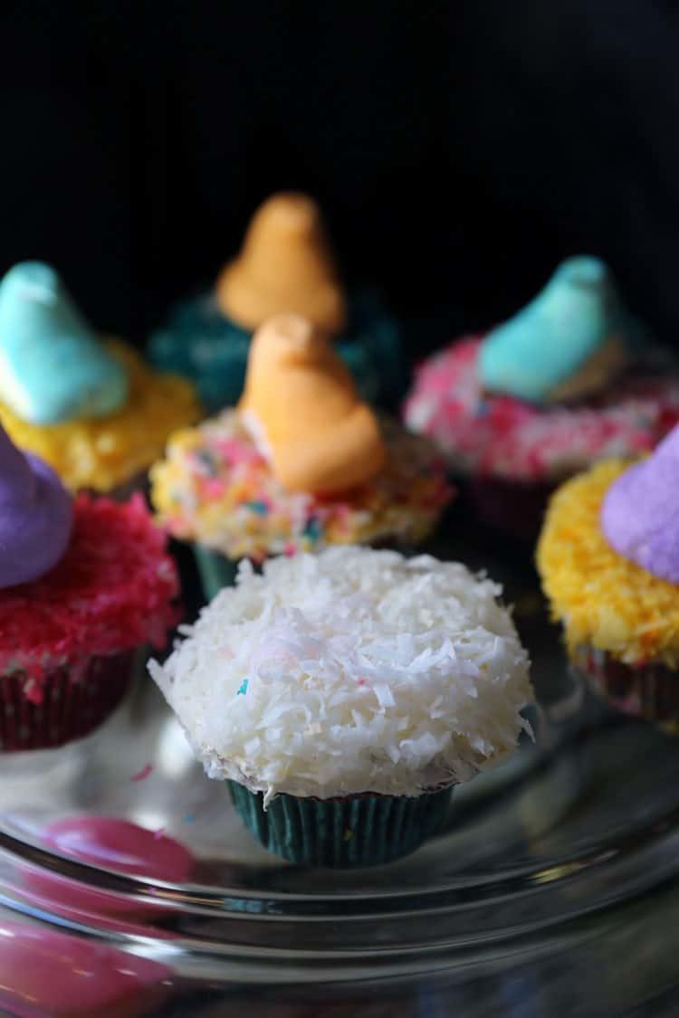 Pineapple Cupcakes with Coconut Butter Cream Frosting and Colored Coconut Shavings